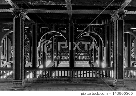 Pont de Bir Hakeim bridge in Paris with steel arches and architectural details, captured as a black and white artistic photograph. High quality photo Pont de Bir Hakeim bridge in Paris with steel arches and architectural details, captured as a black and white artistic photograph. High quality photo 143900560