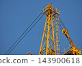 Top Section and Pulley System of Yellow Tower Crane 143900618