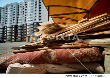 Discarded Household Waste with High Rise Building Background Discarded Household Waste with High Rise Building Background 143900630