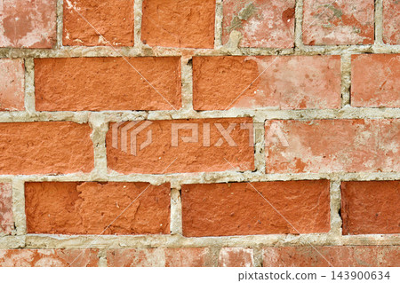Red weathered brick wall texture with concrete mortar Red weathered brick wall texture with concrete mortar 143900634