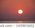 Dramatic Sunrise Over the Sea with City Silhouette and Airplane. 143901602