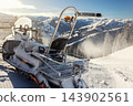 Back view big modern snow mobile scooter atv alpine mountain resort against sunny sky on cold snowy winter day. Snowmobile rental sport adventure trip service. Arctic nordic snow sledge transport 143902561