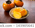 Close-up of a sliced persimmon 143905641