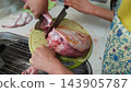 A scene showing the preparation and cooking of a stingray using a knife. 143905787