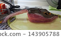 The preparation of the stingray after it has been cleaned and the seafood ingredients 143905788