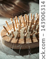 Hair loss; hair tangled in a hairbrush 143906314
