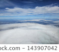 Thick white cloud blanket above coastal terrain 143907042