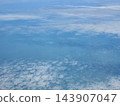 Soft cloud layer above turquoise terrain 143907047