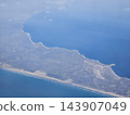 Peninsula and sandy shoreline from high altitude 143907049