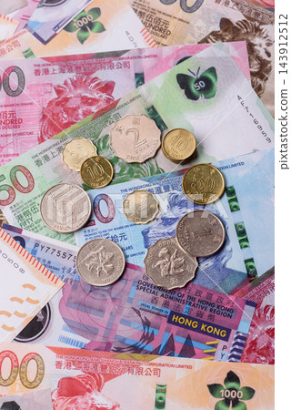 Hong Kong paper money, dollar banknotes and cent coins as currency for exchange or travel Hong Kong paper money, dollar banknotes and cent coins as currency for exchange or travel 143912512