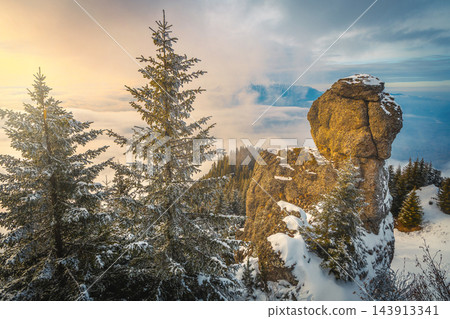 Stunning winter mountain landscape with fantastic rock formation at sunset 143913341