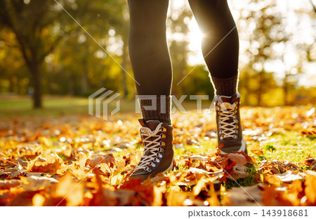 Women's feet walk on autumn leaves in the forest. Rest, relaxation, lifestyle concept. Women's feet walk on autumn leaves in the forest. Rest, relaxation, lifestyle concept. 143918681
