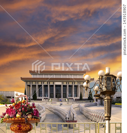 Mausoleum of Mao Zedong with street lamp and huge flower basket (against the sunset), Tiananmen Square, Beijing, China 143918907