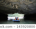 A boat passing through the caves of Ha Long Bay (Vietnam) 143920800