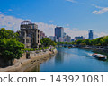 Hiroshima Atomic Bomb Dome, sightseeing boats traversing the Motoyasu River, and the blue sky. 143921081
