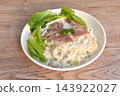 steamed spaghetti topping slice ham pork with dressing white truffle mushroom cream sauce with fresh cos lettuce salad on plate 143922027