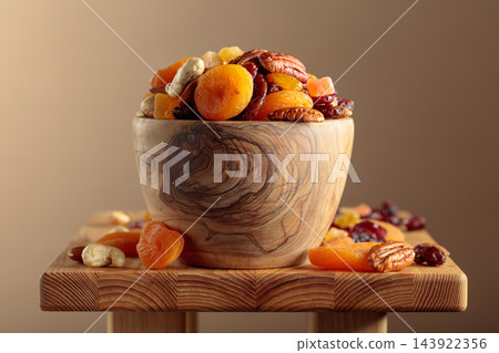 Mix of nuts and dried fruit for a healthy and nutritious snack. Mix of nuts and dried fruit for a healthy and nutritious snack. 143922356