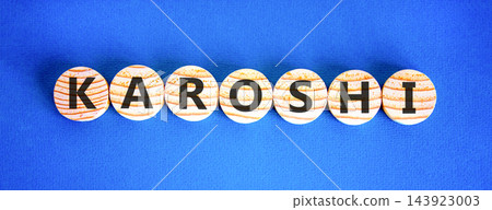 Karoshi word symbol. Concept word Karoshi on beautiful wooden circles. Beautiful blue background. Business medical Karoshi word concept. Copy space. 143923003