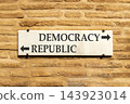 Democracy or republic words symbol. Concept words Democracy Republic on beautiful white sign plate. Beautiful brick wall background. Business democracy republic concept. Copy space 143923014