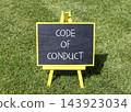 Code of conduct words symbol. Concept words Code of conduct on beautiful black blackboard. Beautiful green grass lawn background. Business Code of conduct concept. Copy space. 143923034