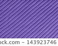 Close up, macro purple knitted fabric texture with diagonal yarn stitches, cloth wool background 143923746