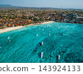 Nusa Lembongan coastline and turquoise ocean with boats, drone view 143924133