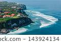 Uluwatu with cliffs, villas and surfing waves in Bali. Scenic landscape in Indonesia 143924134