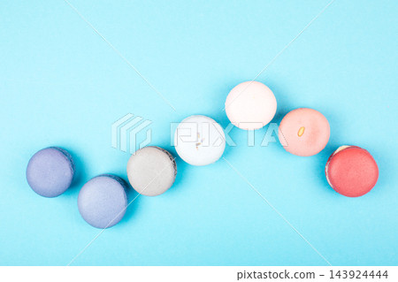 Group of pastel colorful macarons on trendy background Group of pastel colorful macarons on trendy background 143924444