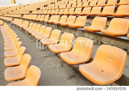 Empty Stadium Bleachers with Orange Seats in Wide Angle View Empty Stadium Bleachers with Orange Seats in Wide Angle View 143924526