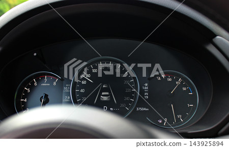 Pre Collision System Display Inside Speedometer on a Dashboard of a Car Moving on Speed. Electronic Radar Calculates Distance to Car Ahead on Highway  143925894