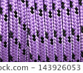 Violet braids weaving a bold pattern of light and shadow 143926053