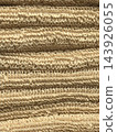 Golden wool loops form a soft tapestry of warmth 143926055