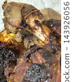 Slow-roasted pork knuckle with crisp, charred edges 143926056
