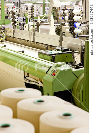 Textile Factory Loom Machine with Yarn Spools 143927448