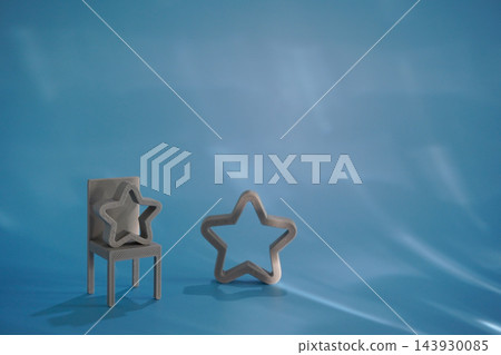 Miniature chair and star symbols set on blue background 143930085