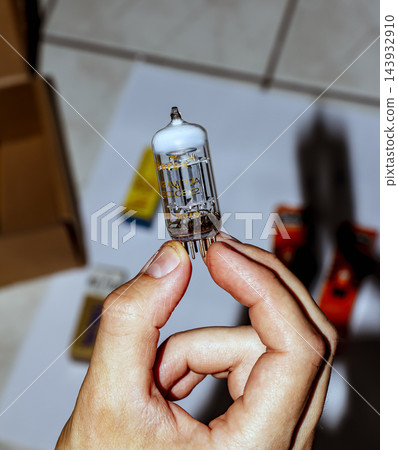 Small Transparent Radio Valve Presented Against Blurred Background 143932910