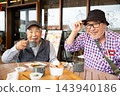 Japanese senior men chatting in a coffee shop. 143940186