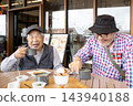 Japanese senior men chatting in a coffee shop. 143940188