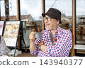 Japanese senior man drinking coffee 143940377