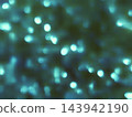 Abstract Teal Bokeh Background with Soft Glowing Light Orbs for Festive Holiday and Celebration Graphic Design Projects 143942190