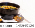 Cream soup with croutons and thyme 143945129