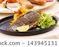 Roast trout with potatoes and lettuce salad 143945131