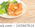 bakind toast bread roll stuffed slice pork sausage and cheese with fresh mixed vegetable salad on plate 143947614