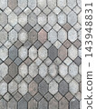 Concrete paving stone pattern with weathered texture in muted gray tones 143948831