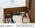 Rediscover creative art with ready to use supplies in an open cardboard box 143950533