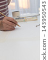 Woman painting in a quiet home workspace, embracing mindful offline creativity 143950543