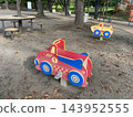 Car-shaped spring play equipment for children playing in the park 143952555