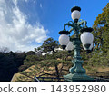 The iconic scenery of the Imperial Palace: the decorative lights of the main gate iron bridge (Nijubashi) and the Fushimi turret. 143952980