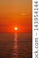 A path of light leading to the rising sun 143954144