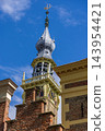 Vertical coastal digital publication of town hall clock tower carillon bells spire historic architecture blue sky Veere Zeeland Netherlands European travel maritime heritage commercial 143954421
